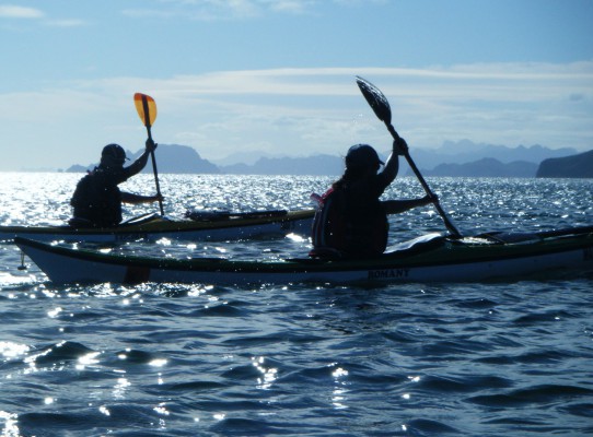 Two kayakers silhouetted